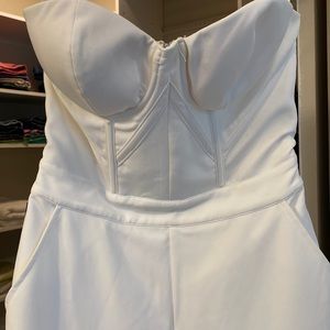 Bebe NWT sexy white jumpsuit. Size 6.